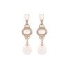 a pair of pearl earrings
